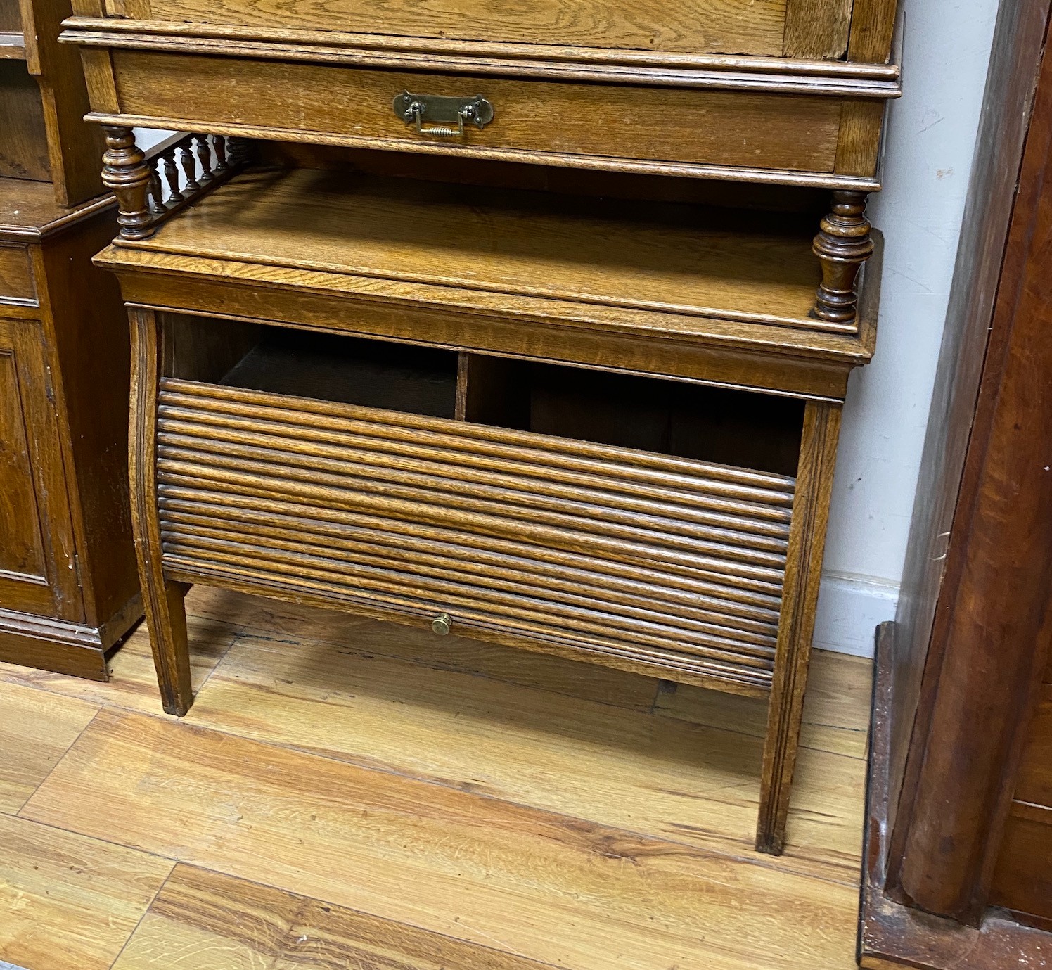 An early 20th century Continental oak writing cabinet, width 70cm, depth 24cm, height 122cm